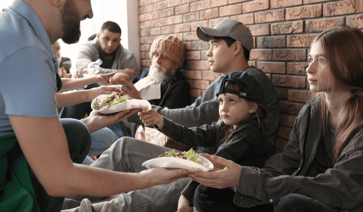 Volunteers serving meals at an emergency shelter