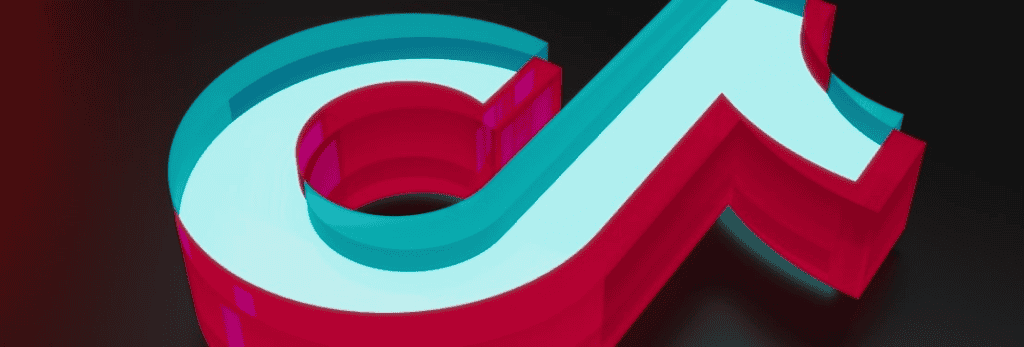 3D rendering of a stylized, bold letter 'd' in turquoise and red, against a dark, reflective background.